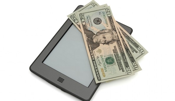 bigstock-Touch-E-reader-With-Money-28895156